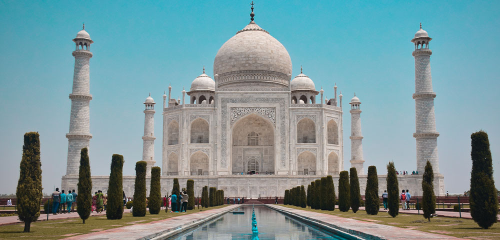 View of the Taj Mahal on a clear day with fountain in front