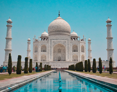 View of the Taj Mahal on a clear day with fountain in front