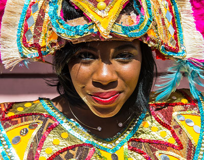 Smiling Bahamas lady in traditional colourful costume