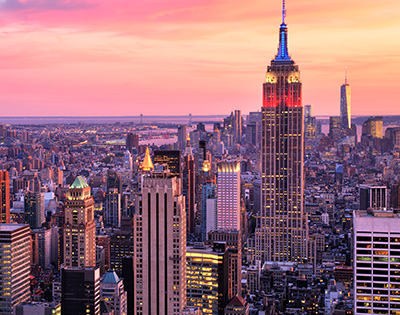 New York city skyline with Empire state building with pink and purple sunset