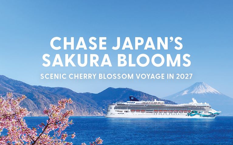 Cruise ship on blue waters with cherry blossoms in the foreground, mountains, and Mount Fuji in the background. Text: 