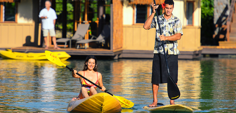 two-people-kayaking-and-stand-up-paddle-boarding-at-koro-sun-resort-fiji