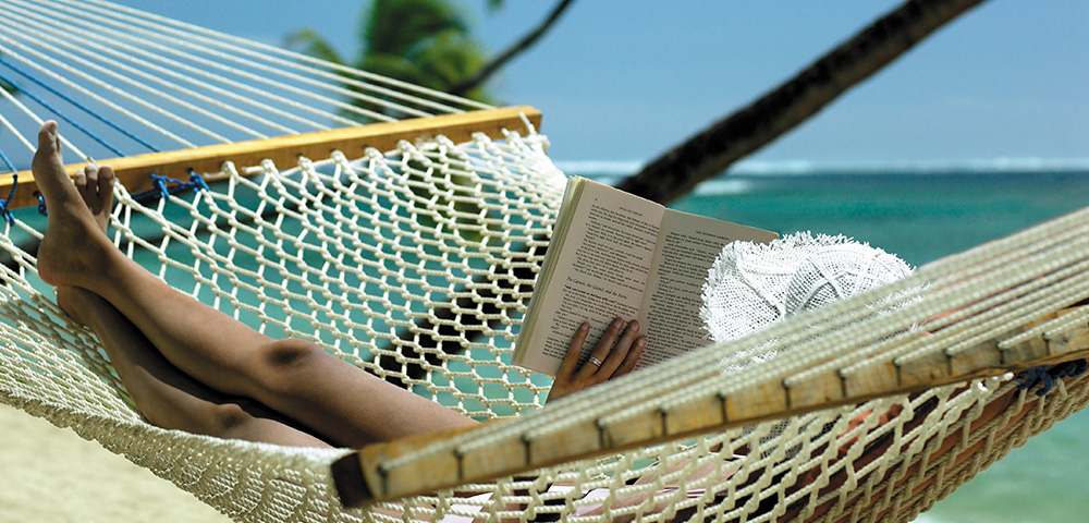 my-fiji-woman-reading-a-book-on-a-beach-hammock-at-shangri-la-yanuca-island-fiji