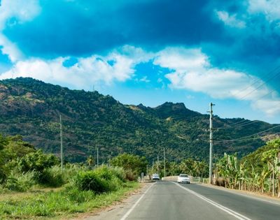 my-fiji-909908894-local-roads-with-mountains-in-distance-in-nadi