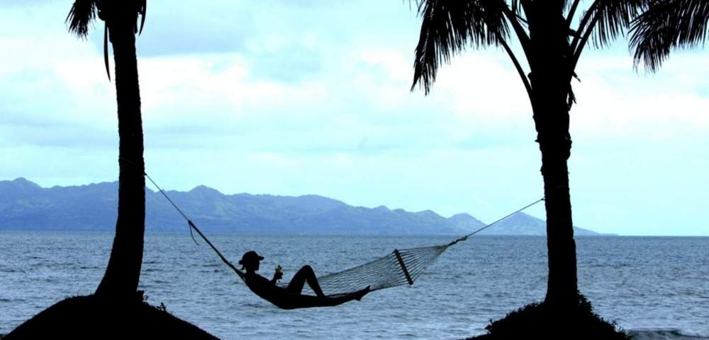 my-fiji-woman-relaxing-in-a-hammock-by-the-water-at-the-pearl-resort-spa-golf-course