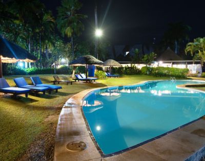 MY-HOLIDAY-Pool-and-lounge-chairs-at-night-at-Tambua-Sands-Beach-Resort