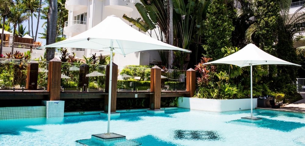 MYQUEENSLAND-alamanda-palm-cove-by-lancemore-RESORTS-OUTSIDE-POOL-WITH-LOUNGE-CHAIRS
