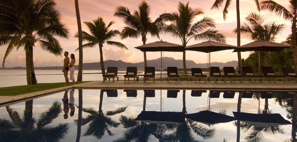 MY-HOLIDAY-Pool-and-lounge-chairs-during-sunset-at-Hilton-Fiji-Beach-Resort-and-Spa