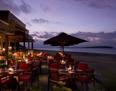 MY-HOLIDAY-Maravu-Restaurant-seating-area-and-beach-during-sunset-at-Hilton-Fiji-Beach-Resort-and-Spa