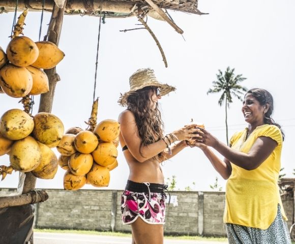 Women buying fruit in Sri Lanka at market