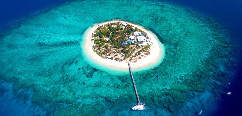 Aerial view of Malamala Beach Club Island with Jetty in Fiji