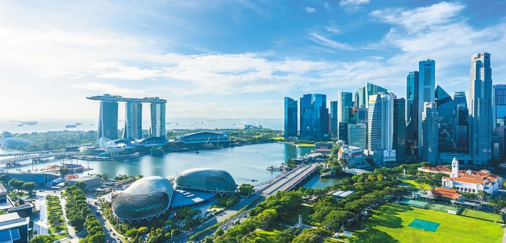 Aerial view of Singapore's skyline with Marina Bay Sands and the Esplanade.