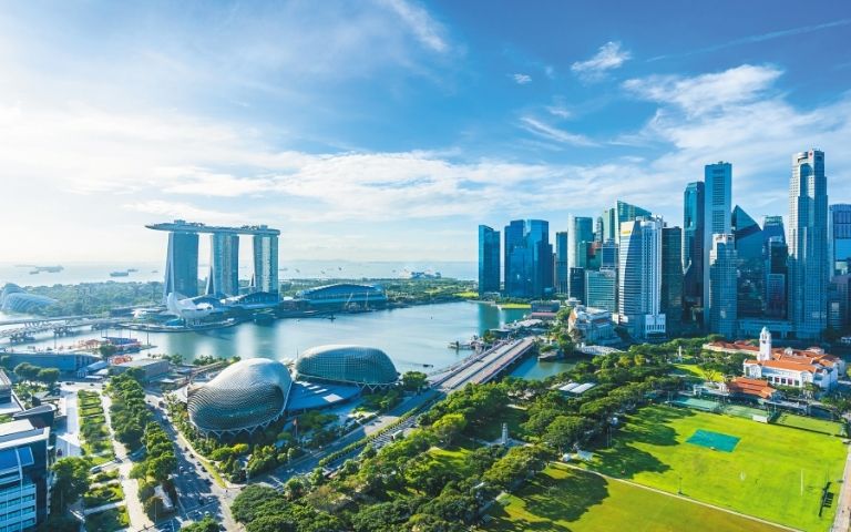 Aerial view of Singapore's skyline with Marina Bay Sands and the Esplanade.