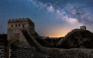 The Great Wall of China under a starry night sky.
