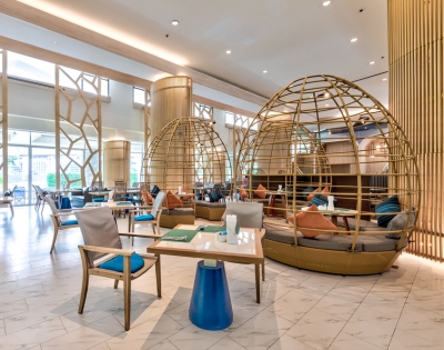 Stylish lounge area featuring unique egg-shaped seating, modern decor, and elegant lighting, creating a relaxing atmosphere.