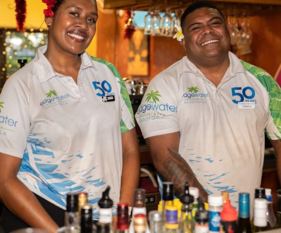 Two bartenders wearing 