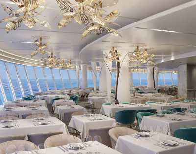 Elegant restaurant with modern decor, featuring butterfly chandeliers, white tablecloths, and panoramic ocean views.