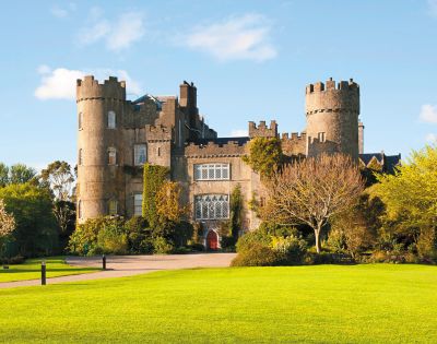 Malahide Castle, Ireland – A medieval castle surrounded by lush greenery and gardens in Dublin, Ireland.