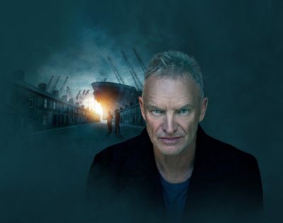 A man with gray hair and a blurred face stands in the foreground wearing a dark coat. In the background, a large ship is docked at a port surrounded by cranes, with two people walking toward it. The sky is dark and cloudy, with light breaking through near the horizon.
