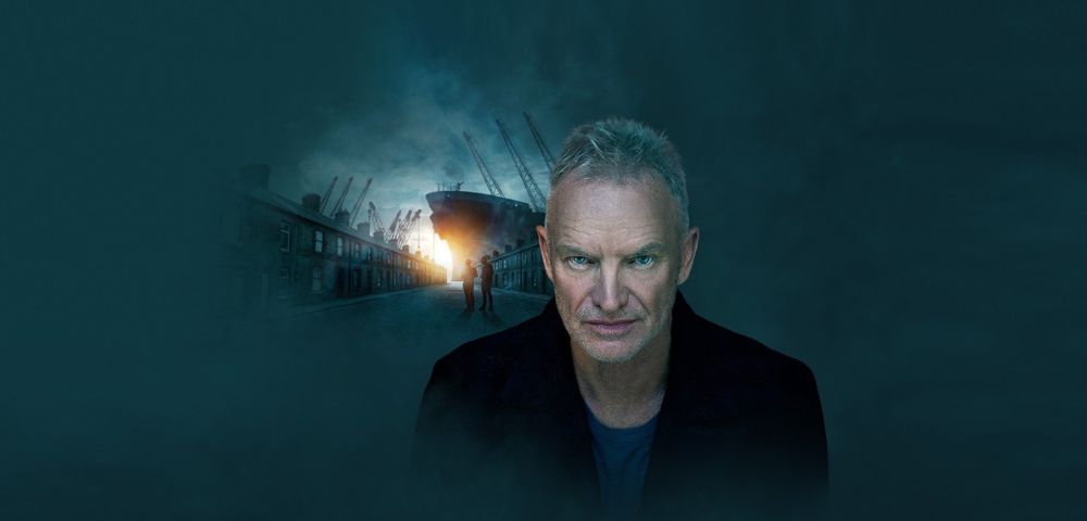A man with gray hair and a blurred face stands in the foreground wearing a dark coat. In the background, a large ship is docked at a port surrounded by cranes, with two people walking toward it. The sky is dark and cloudy, with light breaking through near the horizon.