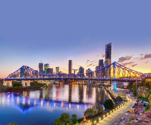 Another angle of the illuminated bridge, highlighting the city skyline in the background.