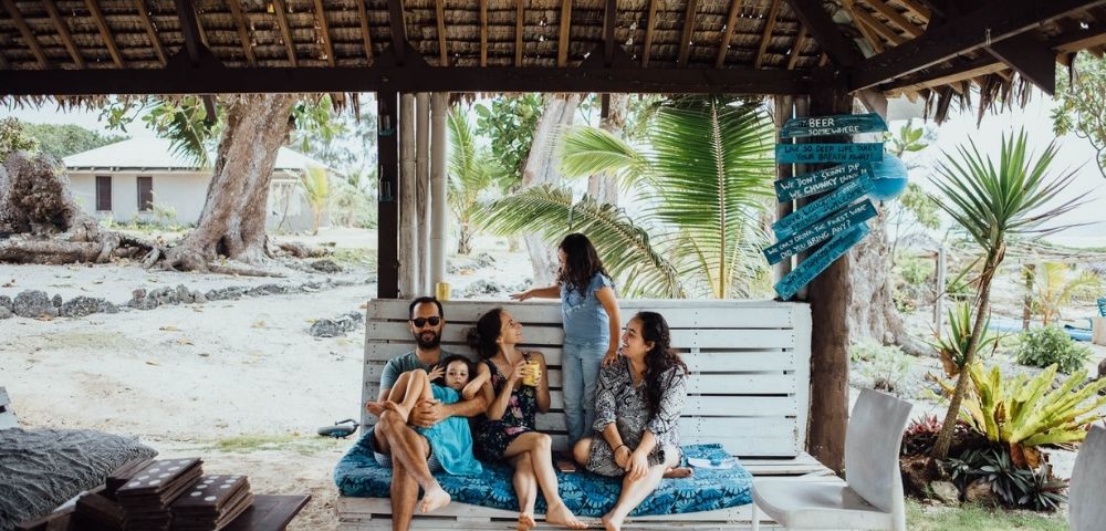 Family playing outdoors in a natural setting.