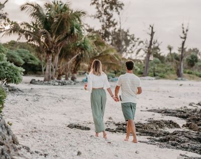 Couple walking near beach.