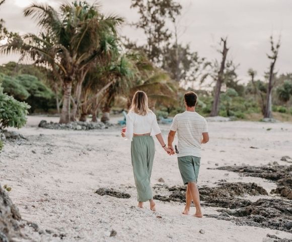 Couple walking near beach.