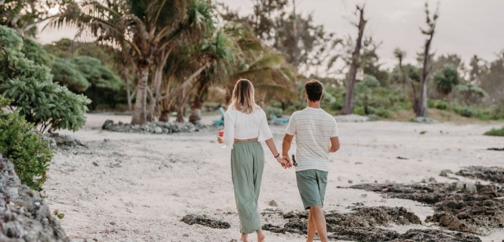 Couple walking near beach.
