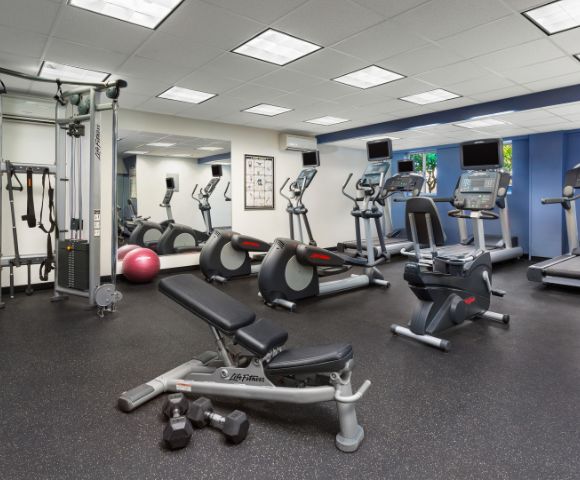 Fitness center with various exercise equipment.