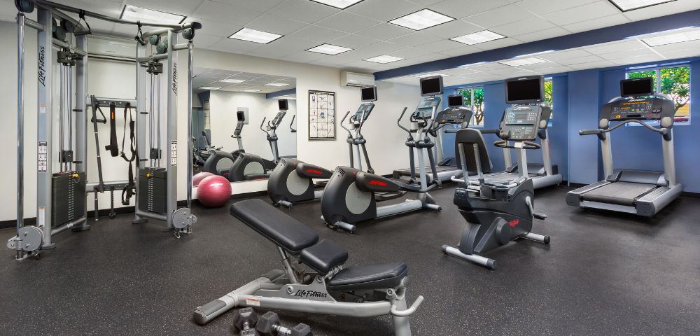 Fitness center with various exercise equipment.