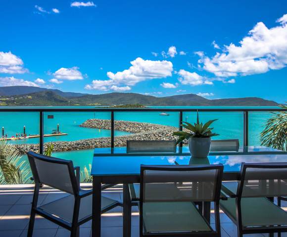 Another inviting pool area surrounded by greenery and tropical landscaping.