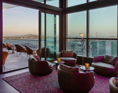 Various angles of hotel rooms, lounges, and pool areas highlighting luxurious design and comfort.