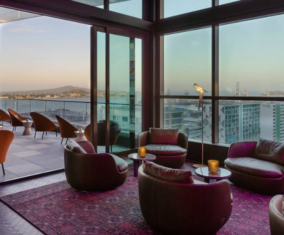 Various angles of hotel rooms, lounges, and pool areas highlighting luxurious design and comfort.