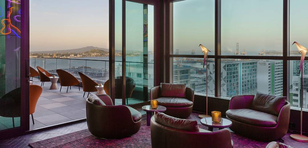 Various angles of hotel rooms, lounges, and pool areas highlighting luxurious design and comfort.