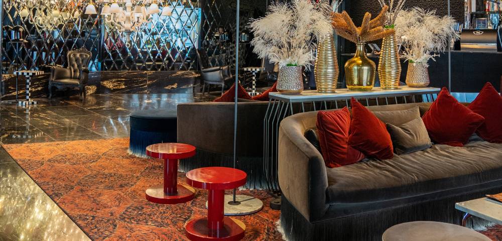 Stylish hotel lounge with contemporary seating and decor.