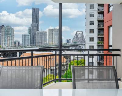 Bright and spacious 1-bedroom apartment featuring large windows and minimalist decor.