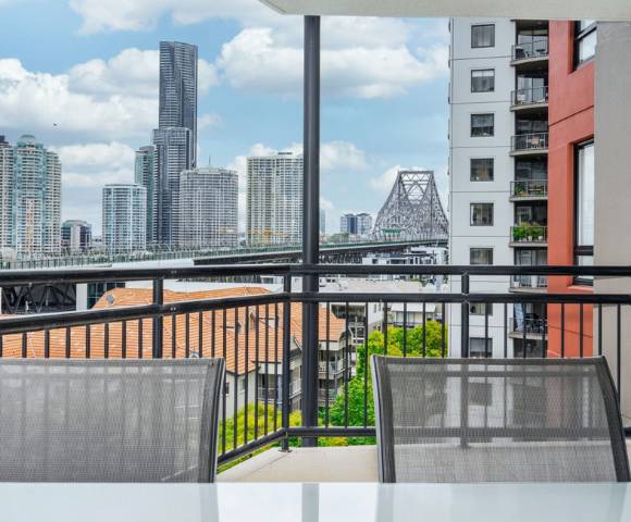 Bright and spacious 1-bedroom apartment featuring large windows and minimalist decor.