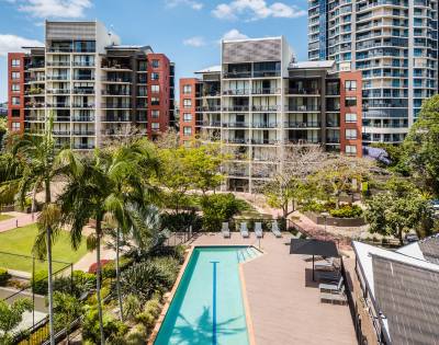 Aerial drone view showcasing the layout and surroundings of The Docks development.