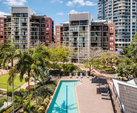 Aerial drone view showcasing the layout and surroundings of The Docks development.
