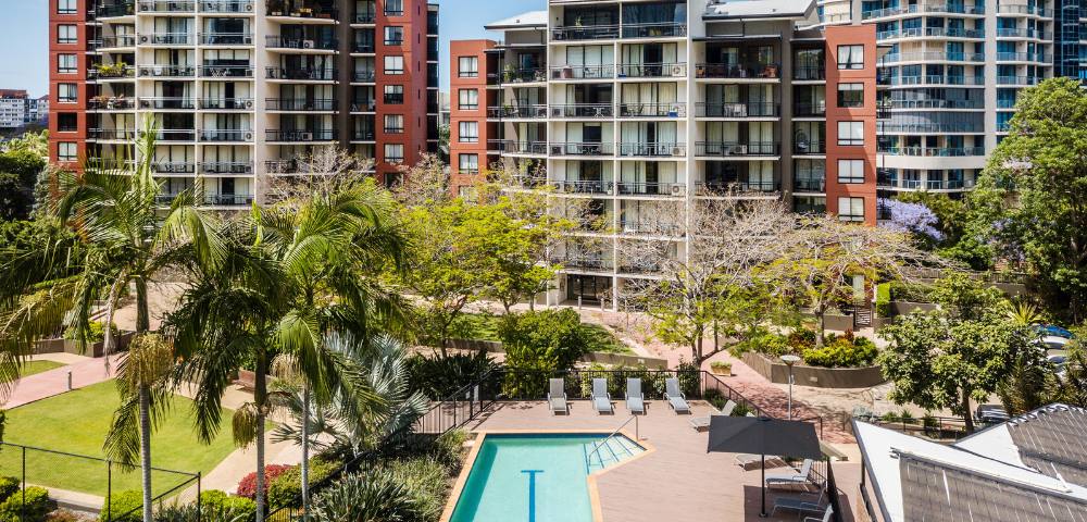 Aerial drone view showcasing the layout and surroundings of The Docks development.