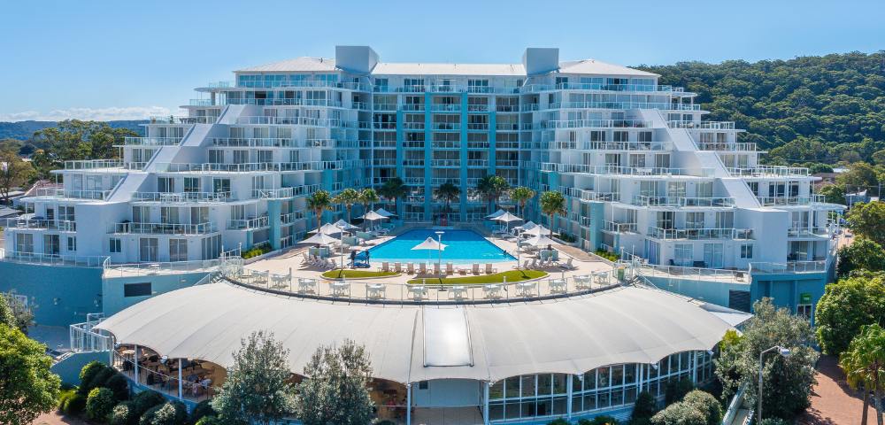 Elevated exterior view of Mantra Ettalong Beach resort showing its architecture and surroundings