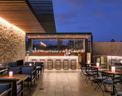 Stylish outdoor seating area with modern furniture and ambient lighting