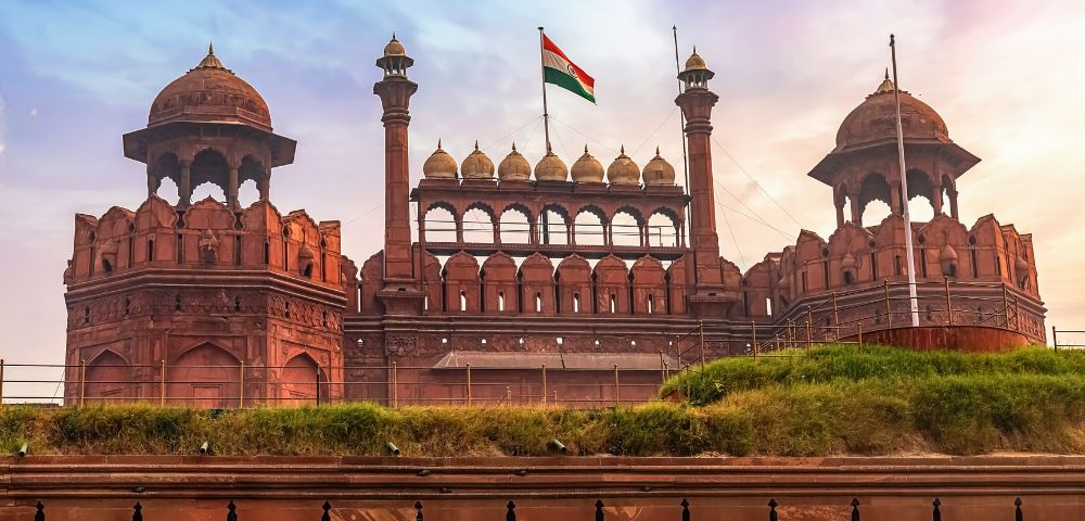 The historic Red Fort in Delhi with the Indian national flag flying above its main gate.