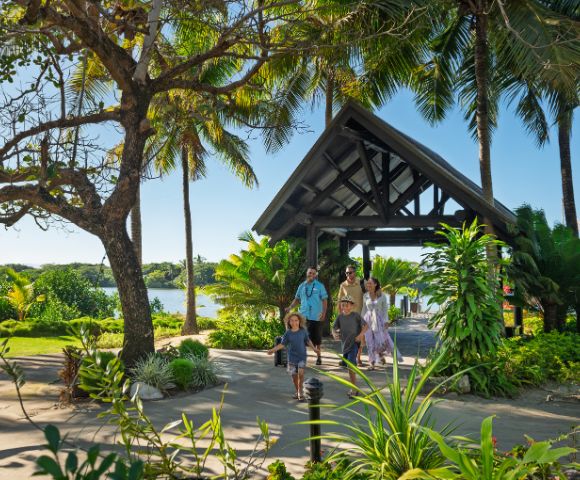 Palm trees and ocean view from a beachfront area at DoubleTree Resort by Hilton Hotel Fiji.