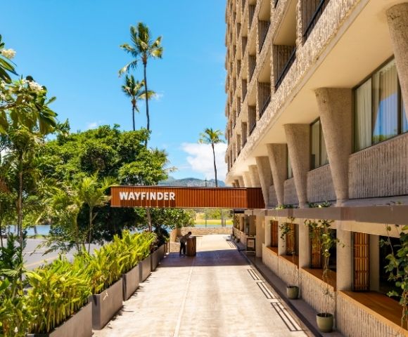A sunlit hotel entrance with a 
