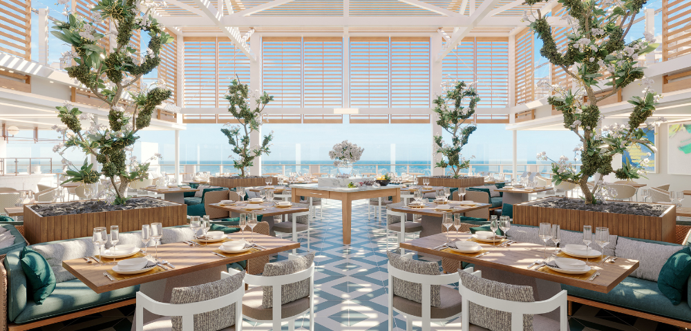 Bright, elegant restaurant with large windows overlooking the ocean. Modern decor features wooden accents, lush trees, and neatly set tables on patterned floors.