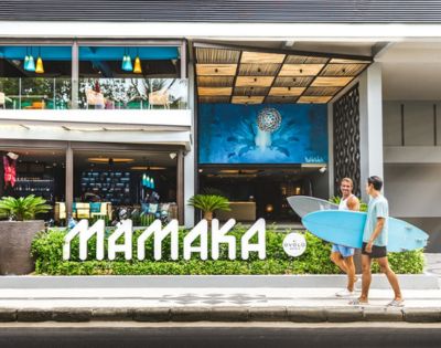 Two people walk past 