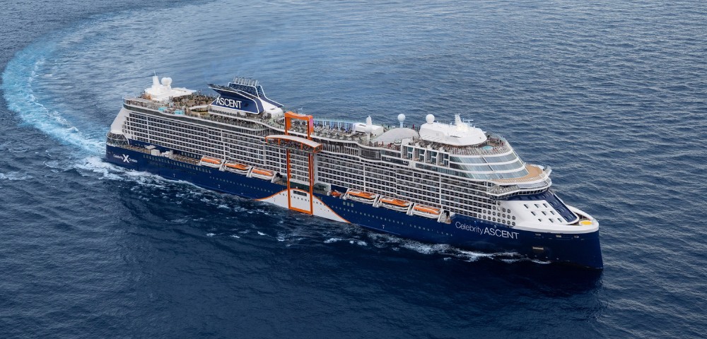 A large cruise ship, the Celebrity Ascent, sails through calm blue ocean waters. The ship's modern design is highlighted by its sleek white structure.