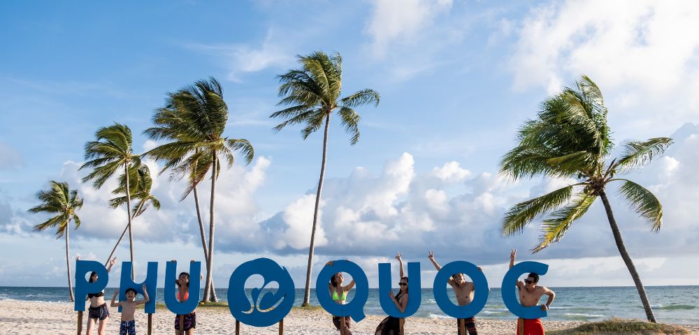 Groups of people interact playfully with large 